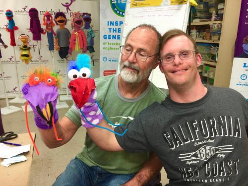 Jason and his Dad love their puppets